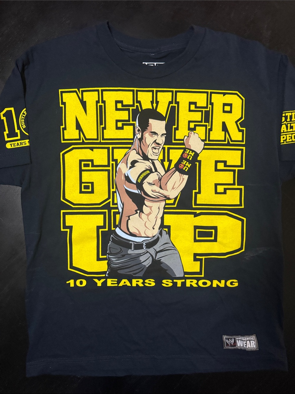 WWE Black Tee with Yellow "Never Give Up" Graphic